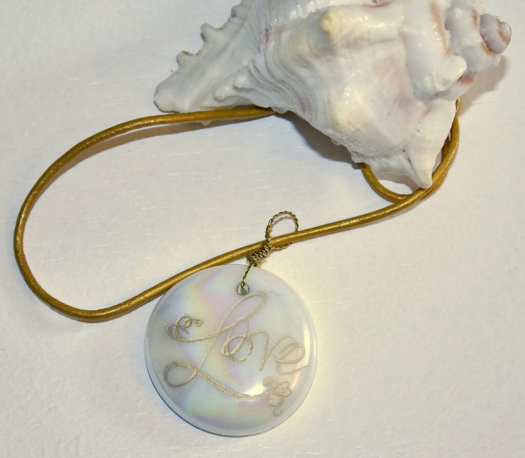 Cream and gold pendant